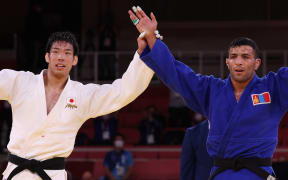 Gold medallist Japan's Takanori Nagase and silver medallist Mongolia's Saeid Mollaei react after the judo men's -81kg gold medal bout.