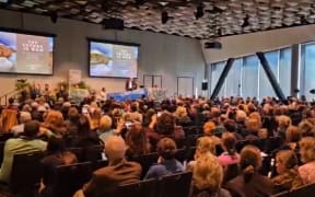 Climate Change Minister Simon Watts was drowned out by School Strike for Climate activists at a conference in Christchurch on 11 June 2024 and later left during the speech.
