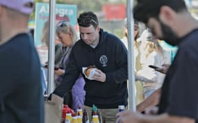 At Sydney's Bondi Beach, voters were partaking in the Australian tradition of a democracy sausage sizzle.