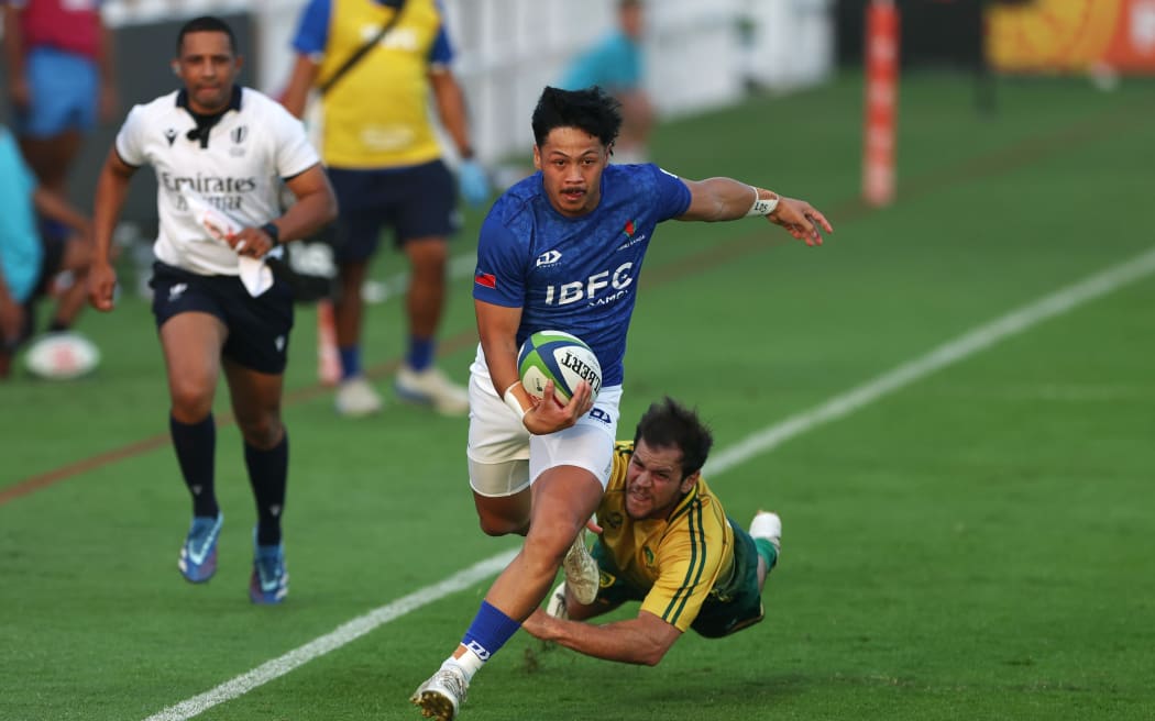 DUBAI, UNITED ARAB EMIRATES - NOVEMBER 08: Latrell Ah Kiong of Samoa avoids a tackle from Lucas Tranquez of Brazil during the Men's Rugby World Cup 2027 Final Qualification Tournament match between Samoa and Brazil at The Sevens Stadium on November 08, 2025 in Dubai, United Arab Emirates. (Photo by Christopher Pike - World Rugby/World Rugby via Getty Images)