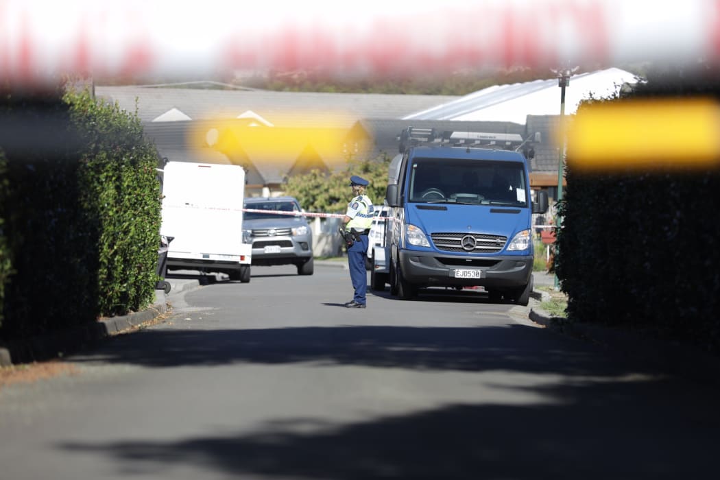 Police at the scene at a retirement village where a 70-year-old woman was found dead.