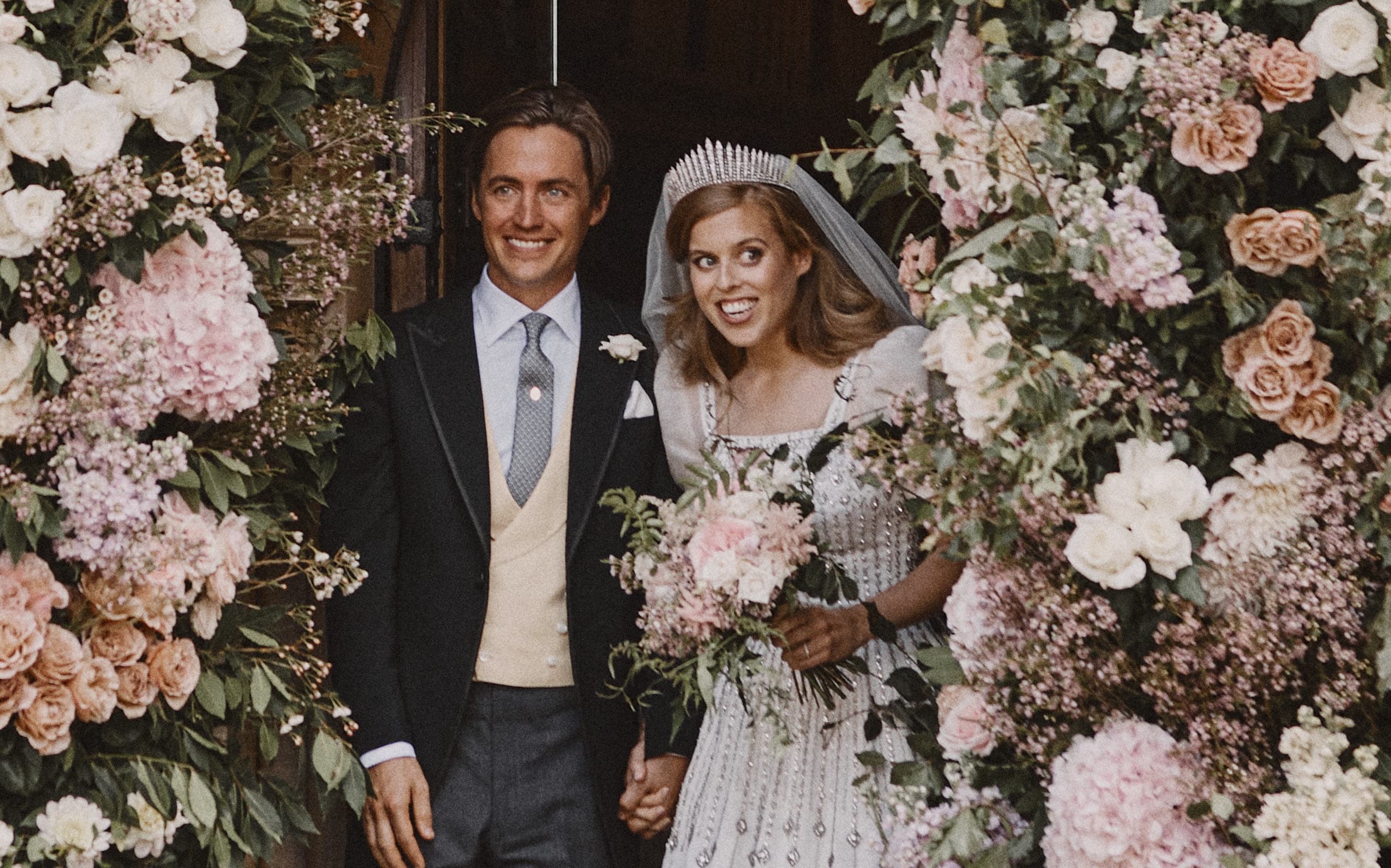 Britain's Princess Beatrice of York and her husband Edoardo Mapelli Mozzi leave The Royal Chapel of All Saints at Royal Lodge, Windsor, west of London, on July 17, 2020 after their marriage ceremony.