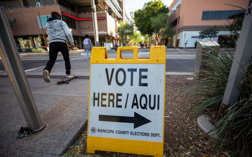 A sign pointing to a polling booth in Phoenix, Arizona
