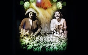 One of the lightboards in the exhibition, of hop pickers in Motueka.