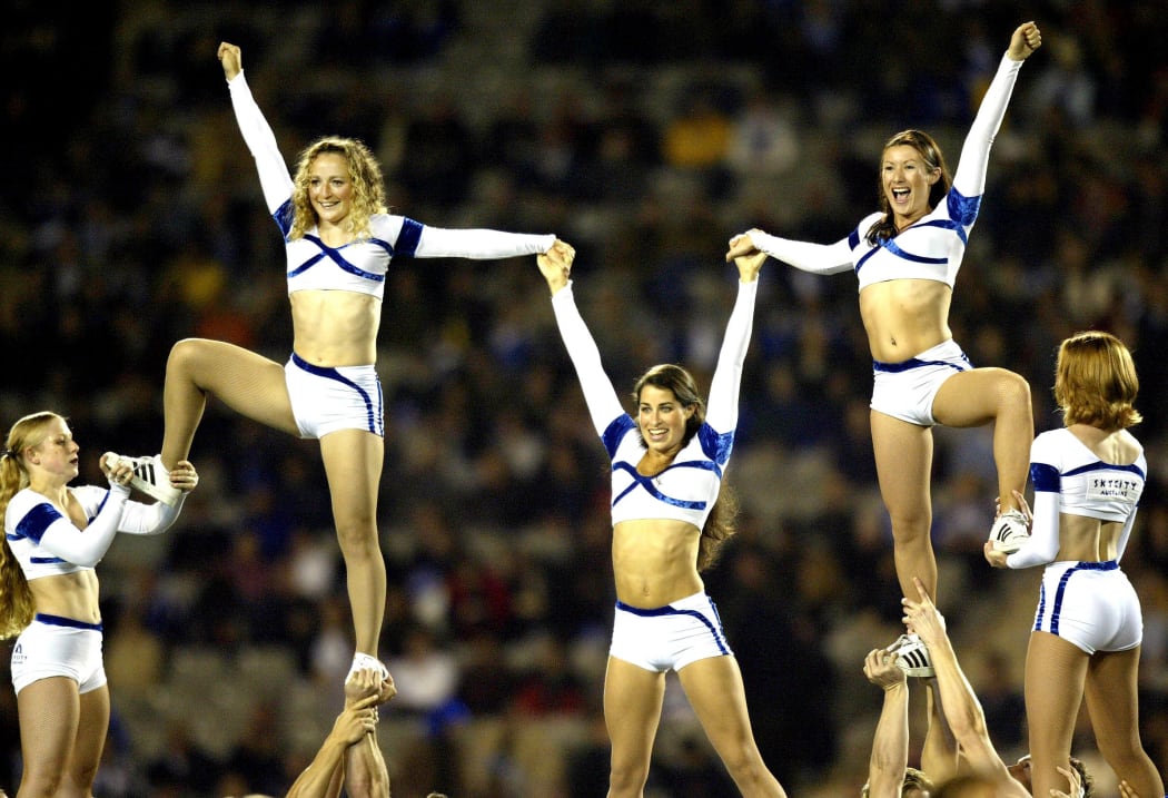 Cheerleaders atop a pyramid