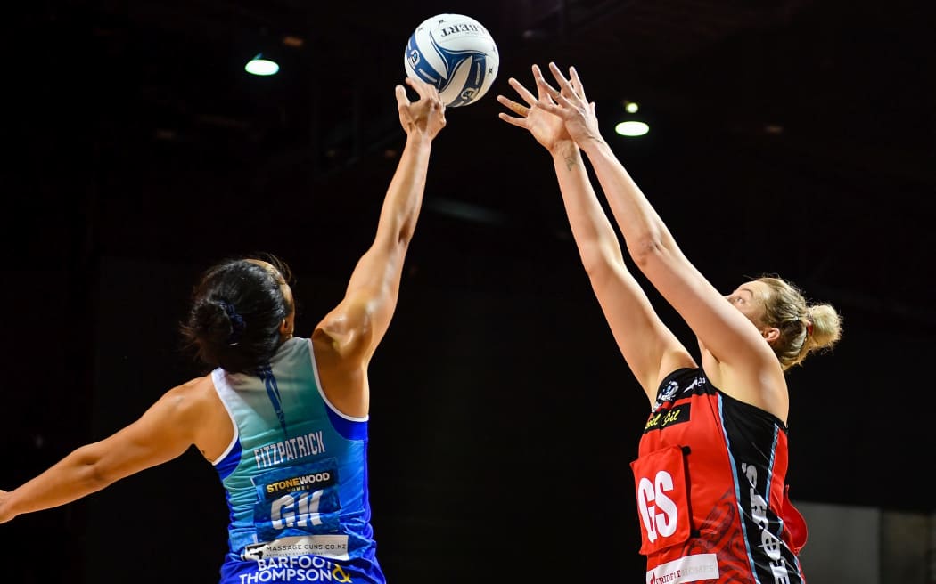 Sulu Fitzpatrick of the Mystics blocks a pass to Ellie Bird of the Tactix during the ANZ Premiership netball match