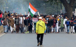 Protesters shout slogans with placards on road  at a demonstration against India's new citizenship Law in Allahabad on December 20, 2019.