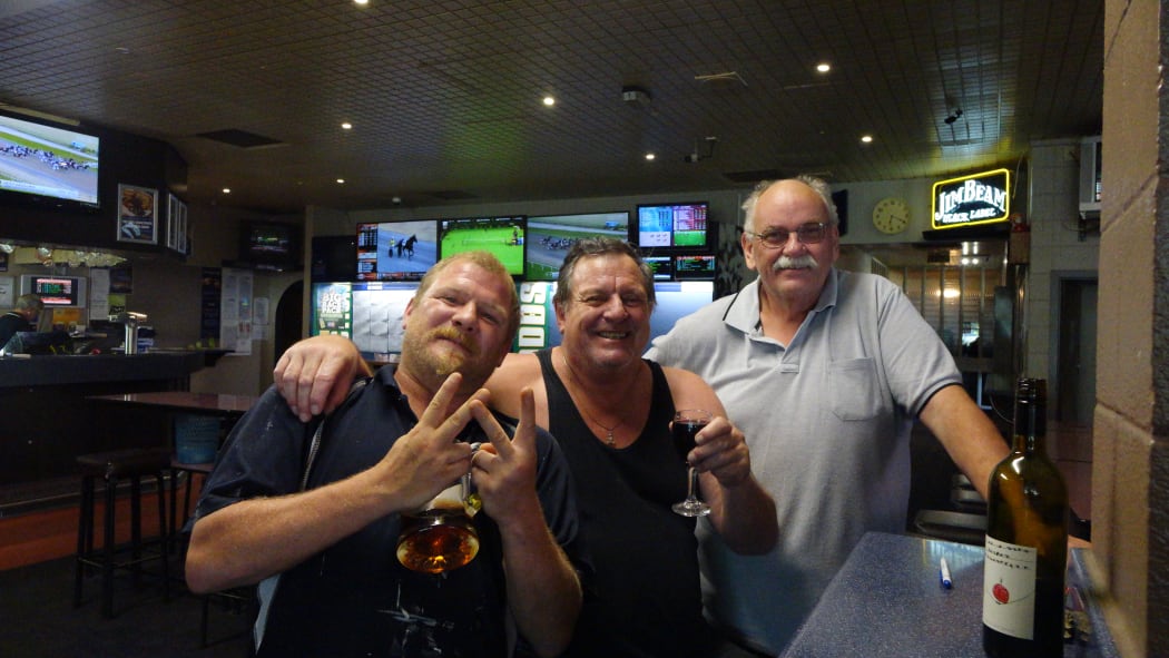 Pub patrons, from left, Pudgey, Lance and Phil, found their cool spot yesterday in Wainuiomata's sweltering heat.