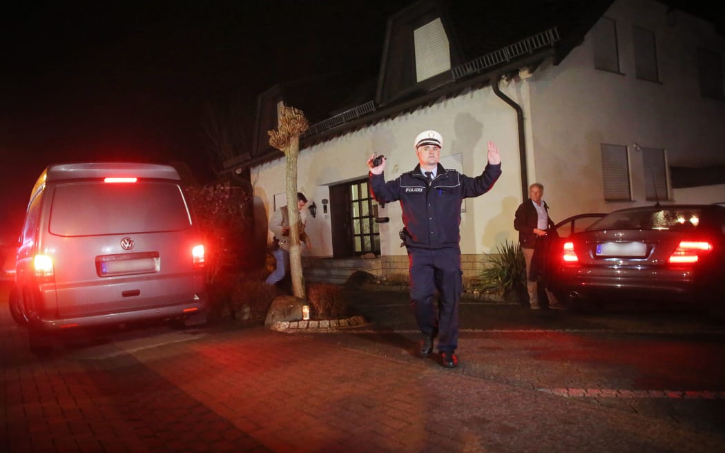 Investigators leave the house of the parents of Andreas Lubitz
