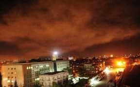 The Twitter page of the Syrian governments central military media on April 14, 2018 shows an explosion on the outskirts of Damascus after Western strikes reportedly hit Syrian military bases.