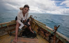 Cristina Mittermeier in a small boat