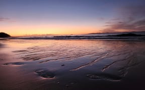 Sunset over Doubtless Bay. James' motto for his salt farm is "Leave Nothing But Footprints"