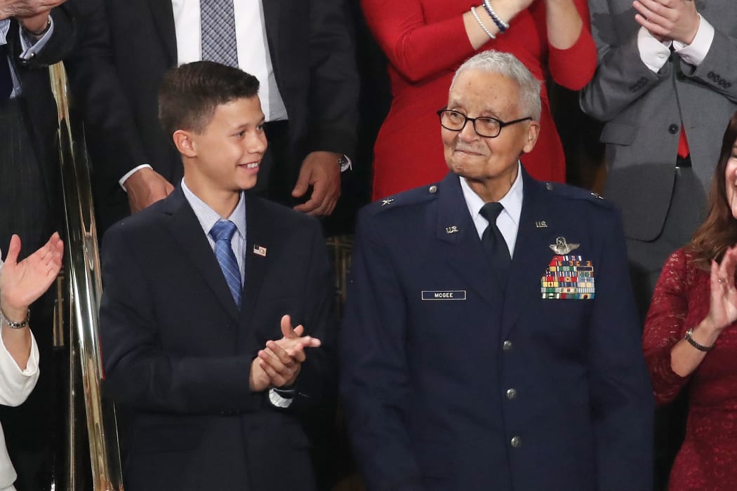 Retired US Air Force Col. Charles McGee, who served with the Tuskagee Airmen, attends the State of the Union address with his great- grandson Iain Lanphier in the chamber of the US House of Representatives in February 2020