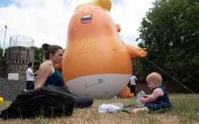British activists created a giant baby Trump balloon to take part in protests against the US president in London on 13 July.