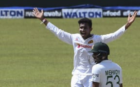 Sri Lanka's Praveen Jayawickrama celebrates after he dismissing Bangladesh's Liton Das during the final day of the second and final test cricket match against Bangladesh in Kandy on May 3, 2021.