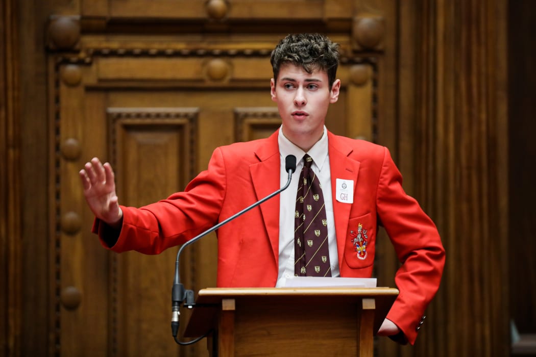 Edward Brougham (Lindisfarne College) slaps away an interjection