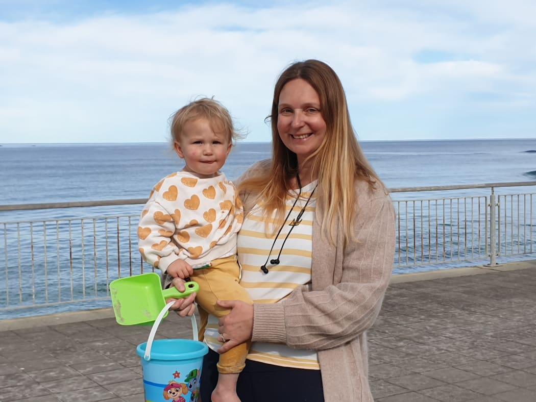 Anna Chilton and her daughter Billie enjoying the weather on St Clair beach.