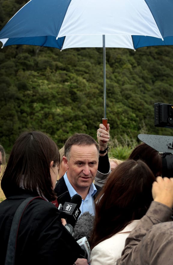 Prime Minister John Key talking to media in the Manawatu Gorge