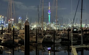 rainbow Sky Tower Auckland, from Westhaven marina, Feb 18, 2024.