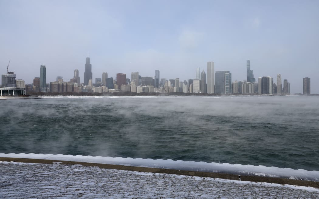 Mist rises from Lake Michigan in Chicago on 23 December, 2022, where temperatures reached -6F (-21C) ahead of the Christmas holiday.