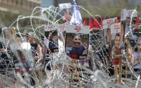 Pictures of Israeli hostages held in Gaza during a demonstration outside the Kirya military headquarters in Tel Aviv, Israel, on 2 August.