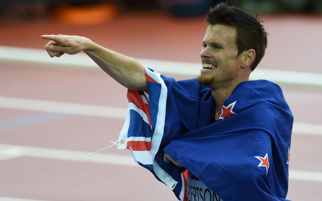The New Zealand runner Zane Robertson celebrates his bronze medal in the 5000m.