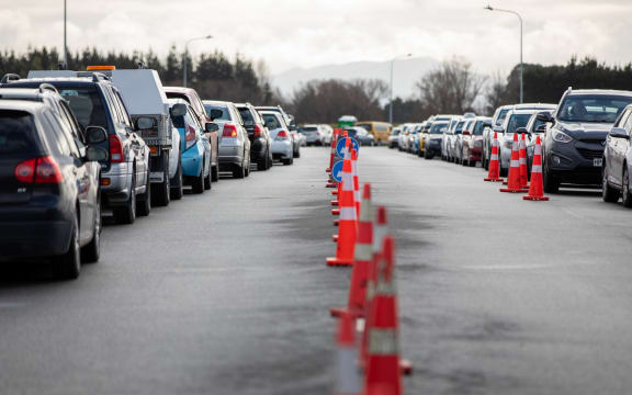 Cars line up as people wait to be tested for Covid-19 at the Orchard Road drive-through testing centre in Christchurch