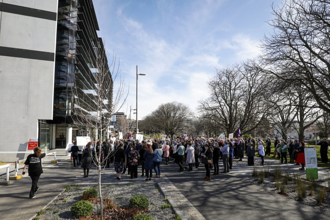 Protesters gather outside of the Canterbury Health Board corporate office on 20 August.