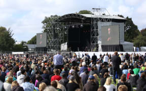 Yusuf/Cat Stevens talks to the crowd at Hagley Park in Christchurch during the national remembrance service