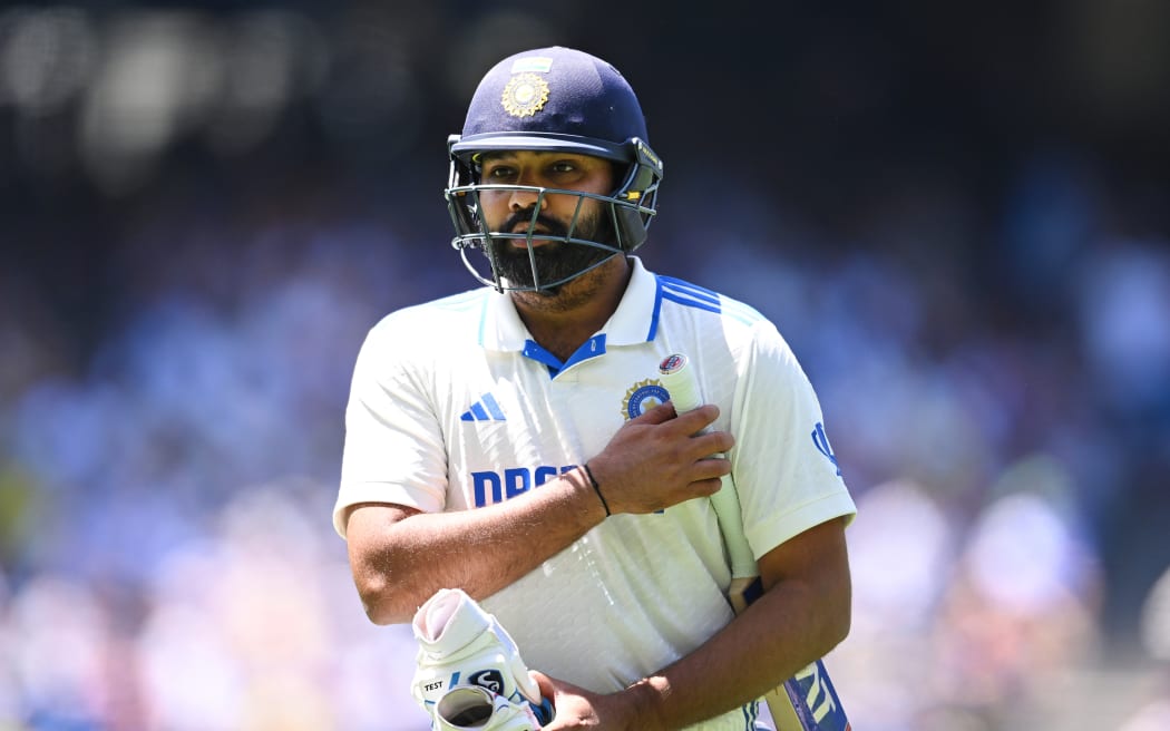 Rohit Sharma exits the field after being dismissed on day five of the fourth cricket test between Australian and India at the Melbourne Cricket Ground.