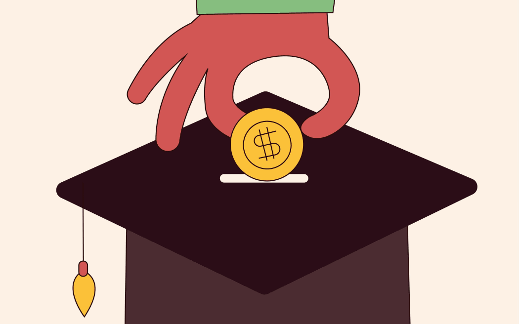 A hand putting money into a university graduation cap.