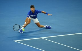 Serbia's Novak Djokovic plays a forehand return against Spain's Rafael Nadal during the men's singles final on day 14 of the Australian Open tennis tournament in Melbourne.