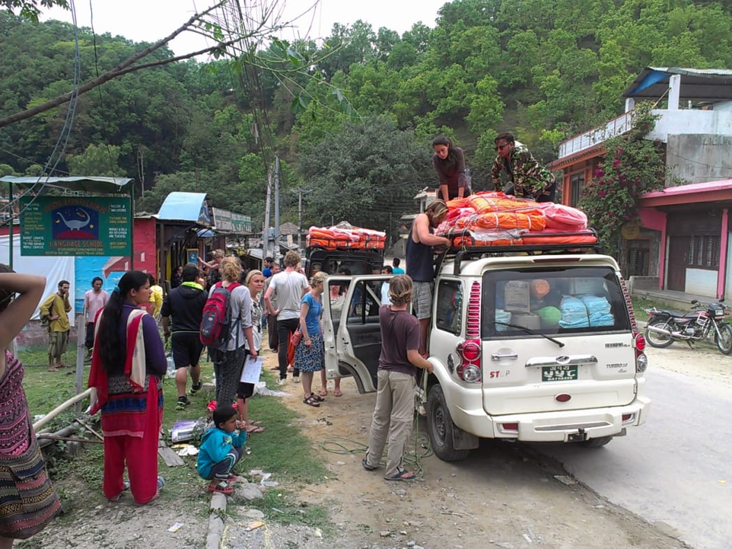 Two Jeeps being loaded outside KarmaFlights bound for Saurpani.