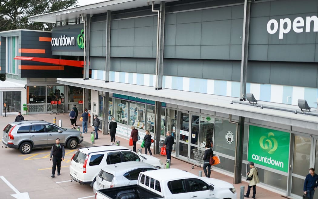 People queueing at a distance from each other outside Countdown, Crofton Downs, Wellington.