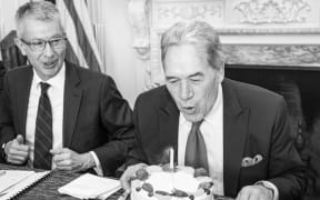 Deputy Prime Minister Winston Peters blowing out a birthday candle during his meeting in Washington.