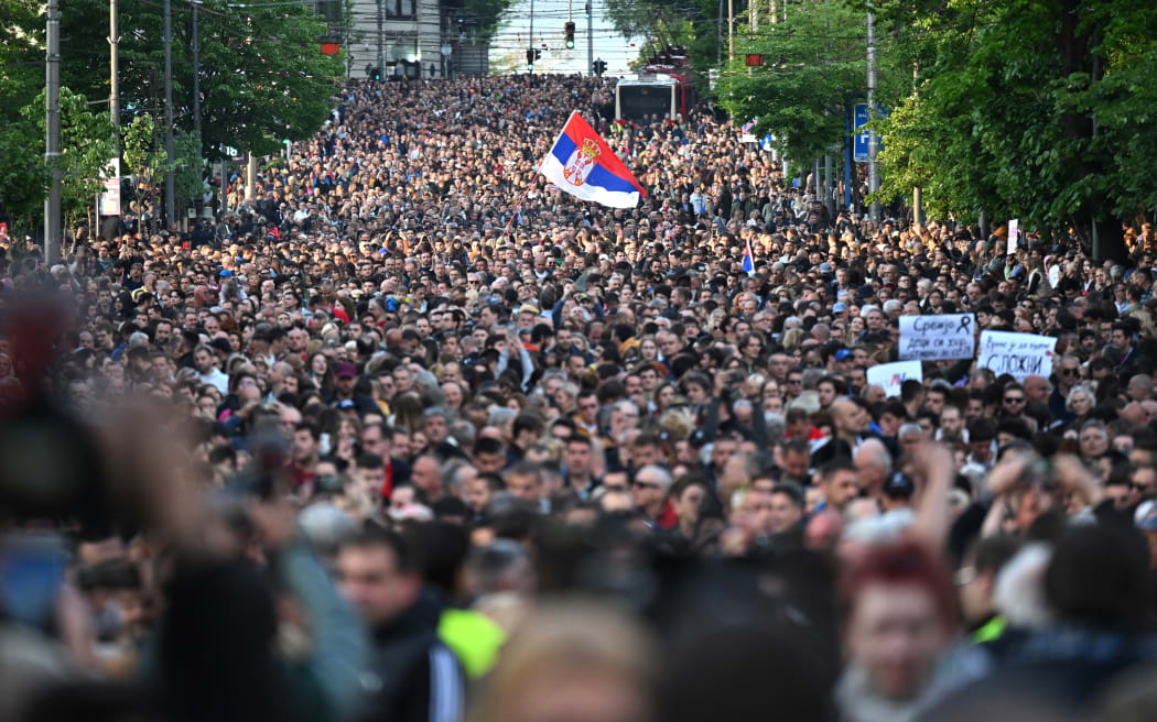 Demonstrators march during a rally to call for the resignation of top officials and the curtailing of violence in the media, just days after back-to-back shootings stunned the Balkan country, in Belgrade on May 8, 2023.