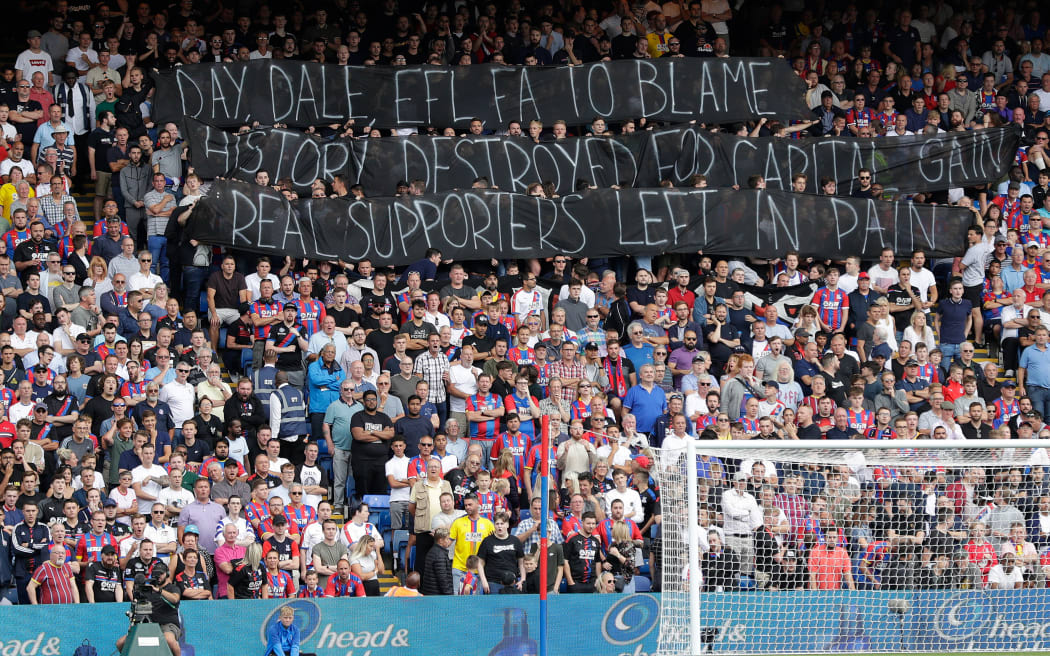 Crystal Palace fans display a banner in solidarity with Bury FC, who were expelled from the Football League in 2019 amid rising debts.