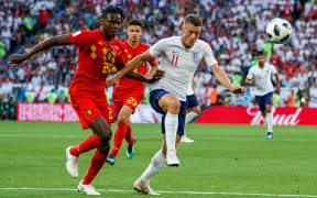 England's Jamie Vardy and Belgium's Dedryck Boyata contest possession.