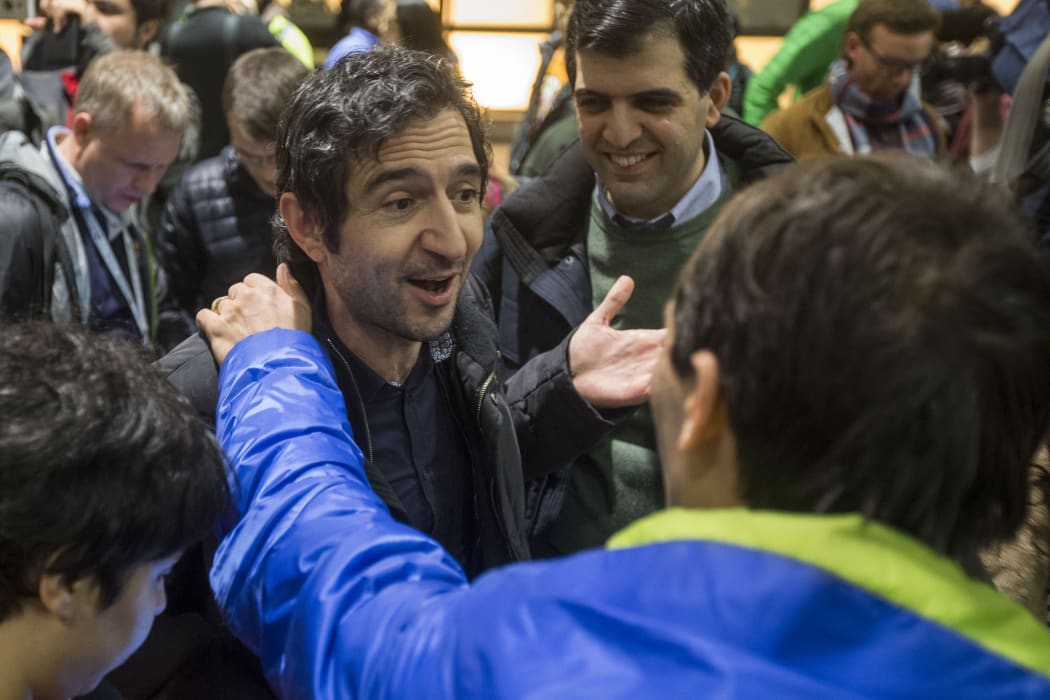 Mazdak Tootkaboni is welcomed during a demonstration against the new ban on immigration issued by President Donald Trump at Logan International Airport on January 28, 2017 in Boston, Massachusetts.
