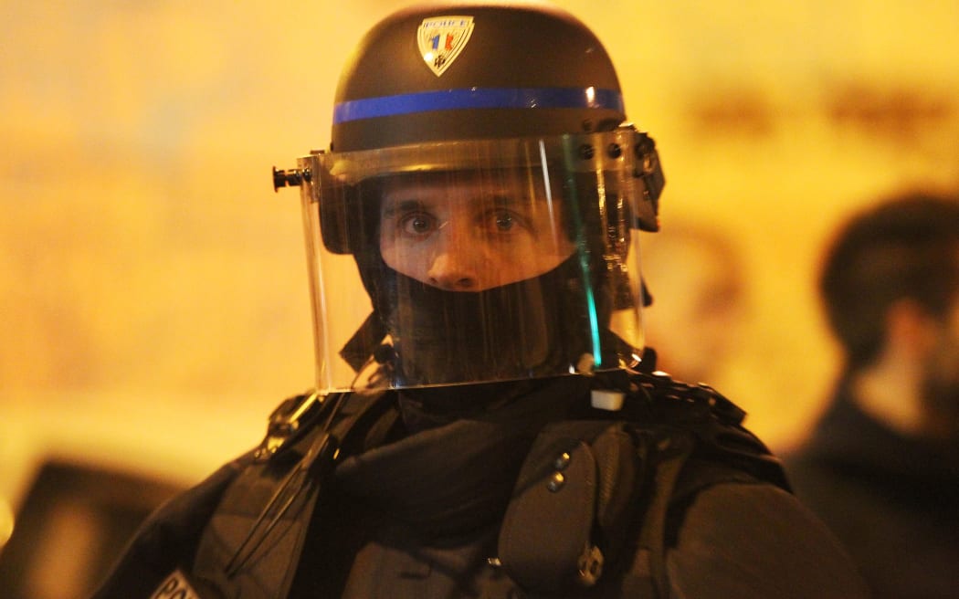 A police officer watches on near Bataclan concert hall in Paris in the early hours of November 14.