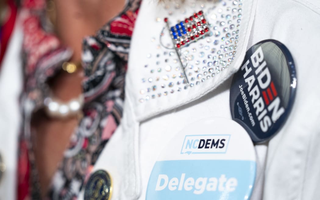 A woman wears a North Carolina delegate button during a campaign event with vice president Kamala Harris at James B. Dudley High School on 11 July, 2024 in Greensboro, North Carolina.