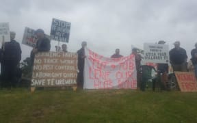 About 200 people gathered in Tāneatua to protest the removal of Te Urewera Department of Conservation backcountry huts.