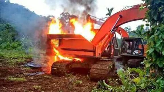 Logging equipment being burnt on Vanikoro, 2016.