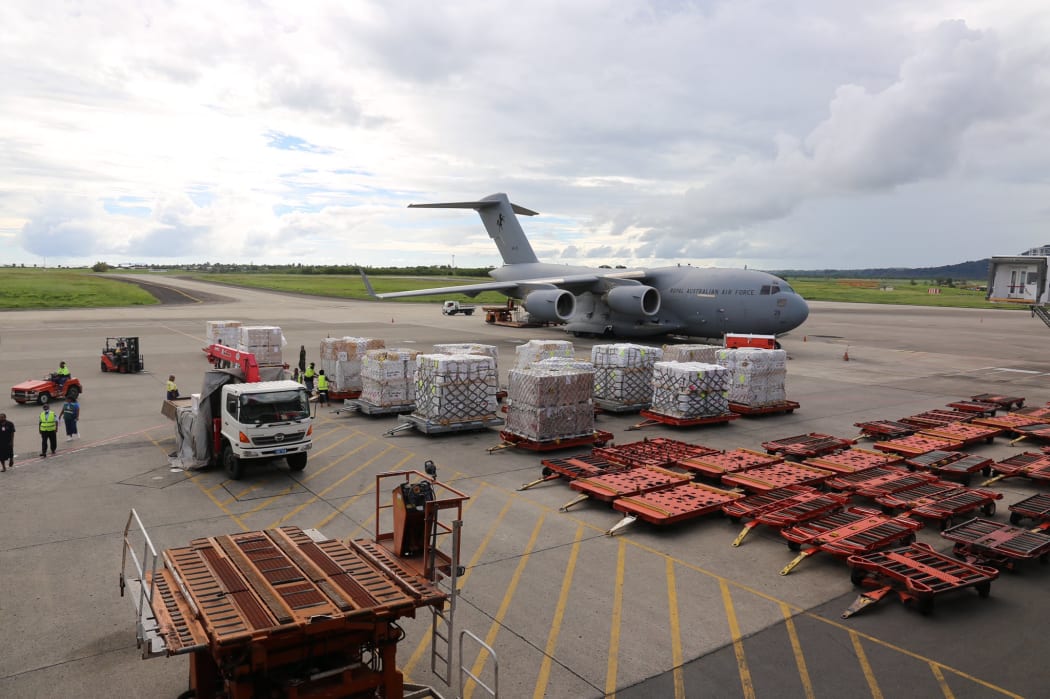 A C-17 aircraft from the Australian Air Force arrives with relief supplies.