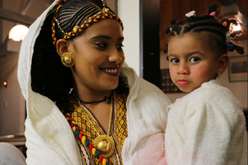 Mother and daughter dressed for Ashenda