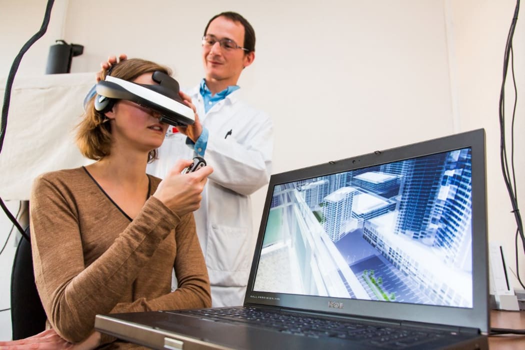 Woman during a session of virtual reality therapy to treat acrophobia or extreme fear of heights. Department of Psychiatry, Pitie-Salpetriere hospital,