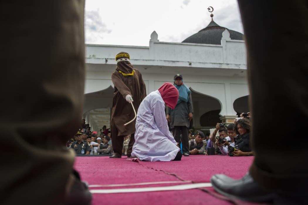 File photo of a woman in Indonesia who was previously caned in public.