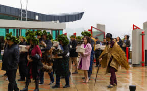 Iwi delegation arrive on to Rongomaraeroa, carrying the tūpuna and karāpuna through the waharoa and Ranginui doors at Te Papa’s repatriation pōwhiri.