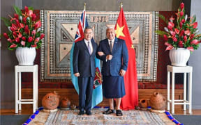 Chinese Foreign Minister Wang Yi and Fiji Prime Minister Frank Bainimarama.