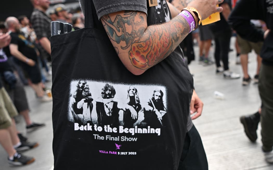 Fans watch support acts, during British rock band Black Sabbath's "Back to The Beginning" concert, Ozzy Osbourne's final ever gig as Black Sabbath's frontman at Villa Park in Birmingham, central England on July 5, 2025. Osbourne, who revealed in 2020 that he has Parkinson's disease, will join Tony Iommi, Geezer Butler and Bill Ward for the all-day "Back To The Beginning" show in Birmingham, central England, where the heavy metal giants formed in 1968. (Photo by ANDY BUCHANAN / AFP)